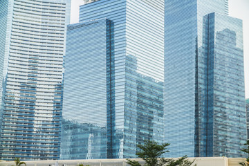 Obraz na płótnie Canvas Skyscrapers with glass facade. Modern buildings in business district. Concepts of economics, financial, future
