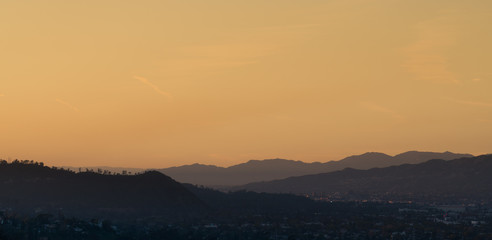 Fototapeta na wymiar Sunset landscape view of silouette mountains in Los Angeles California