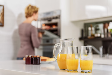 Woman cooking healthy breakfast in kitchen