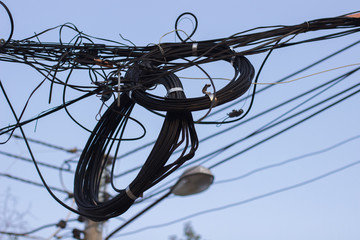 Wire assemblage a lot of cables and wires on pole in the city , the many cable wire on the pillar