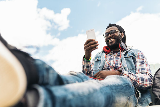 American man using mobile.
