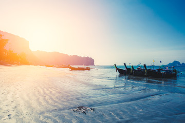 Obraz premium Thailand summer travel sea, Thai old wood boat at sea beach Krabi Phi Phi Island Phuket park on white sand blue sky emerald green ocean water.