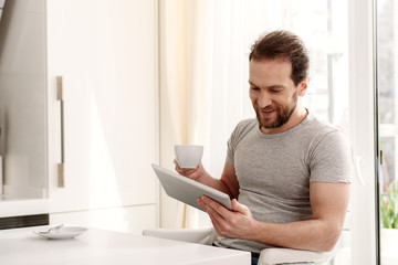 Happy guy relaxing in cook room