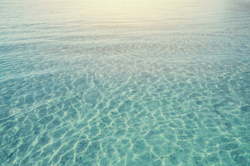 sea water clean and clear wave. ocean with the morning sun light.
