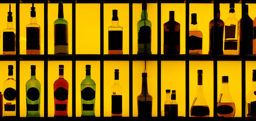 Various alcohol bottles in a bar