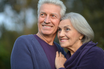 Happy elderly couple embracing