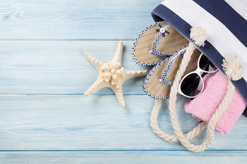 Beach accessories on wooden background