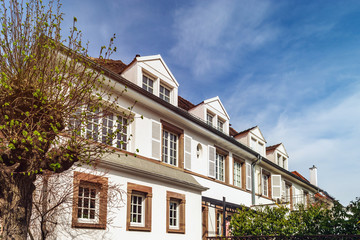 Classic french house in residential district of Strasbourg, blossom spring time, flowering and gardening.