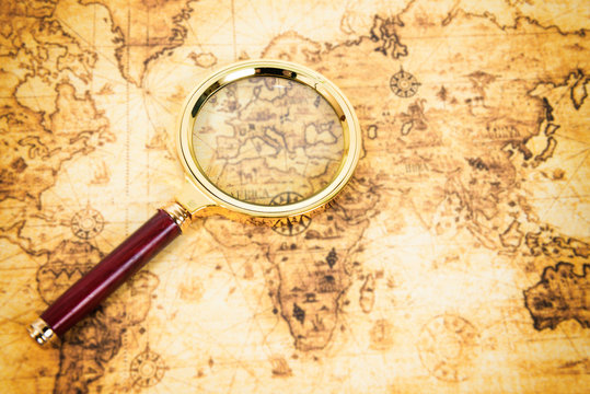 Old map with an magnifying glass