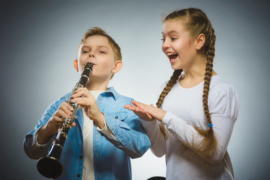 The Boy Plays The Bassoon And The Girl Applauds