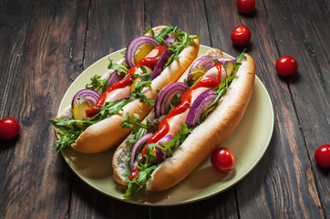 Hot dog. Grilled hot dogs with ketchup on a wooden table.