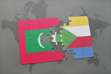 puzzle with the national flag of maldives and comoros on a world map