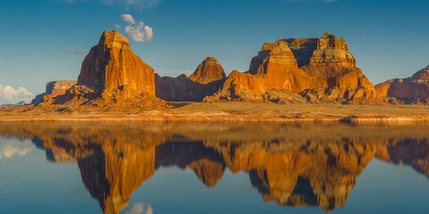 Fototapeta na wymiar Red Rock Mountain Cliffs with a Lake Reflection
