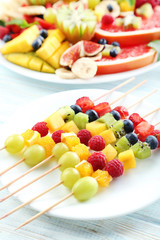 Fresh fruit salad on a white wooden table