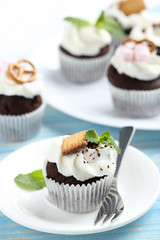 Chocolate cupcakes on a blue wooden table