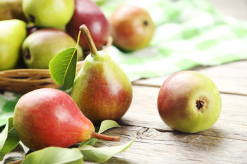 Ripe pears on grey wooden table