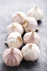 Garlic on the grey wooden table