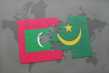 puzzle with the national flag of maldives and mauritania on a world map