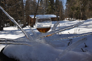 A glass of wine in the snow