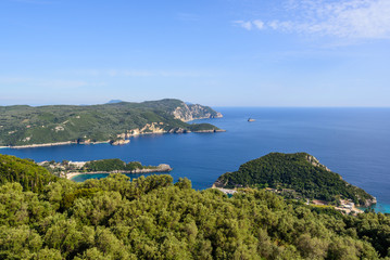The bay of Palaiokastritsa located on the northwest coast of Corfu with rocky coast and isolated picturesque coves with sandy beaches. A view from above. Greece.