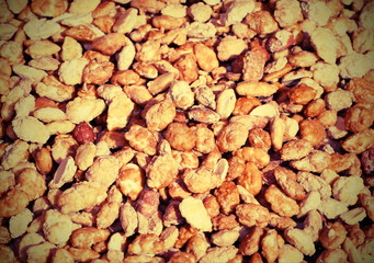 background with lots of peanuts and covered with cooked sugar