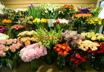 Colorful roses and other flowers at the entry to flower shop,Bouquet decorate in front of flower shop,Many flowers in the market,flowers at farmers' market