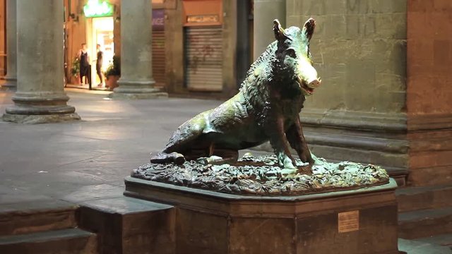 Florence – October 2016: Tourists visiting Il Porcellino or the piglet, the famous Florentine bronze fountain of a boar, on October 2016 in Florence
