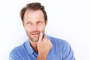 Fototapeta premium Close up handsome man thinking with hand on chin