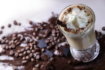 Cappuccino cinnamon, coffee beans and chocolate