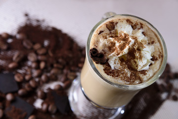 Cappuccino cinnamon, coffee beans and chocolate
