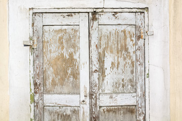 Close up of old wooden door with cracked paint
