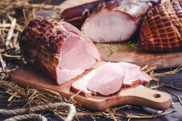 Foto auf Alu-Dibond Smoked piece of ham sliced meat on wooden desk. Vintage retro food background. © Paweł Michałowski