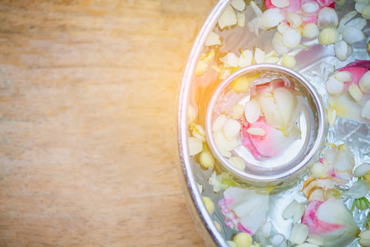 Jasmine and roses flower in water bowl, Songkran festival background in Thailand