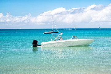 man, yachtsman on motorboat on water, in St. John, Antigua