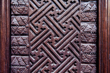 Details of a fine wood carving art. Carved wooden pattern