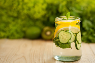 healthy food concept. milkshake in glass and fresh green vegetables. detox diet