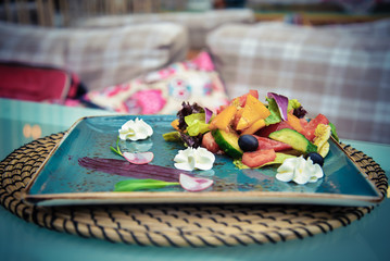 Decorated plate with vegetable salad