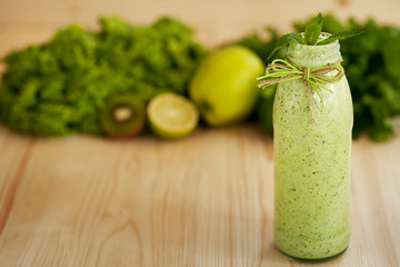 healthy food concept. milkshake in glass and fresh green vegetables. detox diet