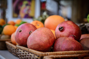 Large pomegranate in the basket