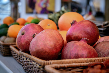 Large pomegranate in the basket