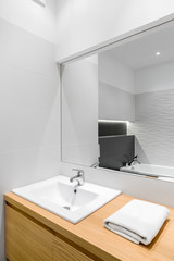 New bathroom with wooden cabinet