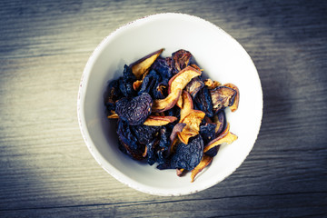 dry fruit in white bowl on wooden floor or table