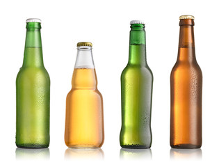 Collection of full beer bottles with no labels isolated on white background