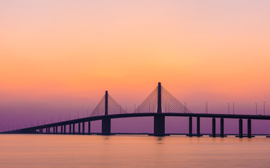 Fototapeta na wymiar landscape bridge sunset colors sea 