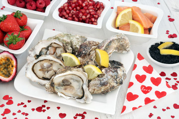 Aphrodisiac Food for Valentines Day with Oysters, Caviar, Salmon and Fruit.