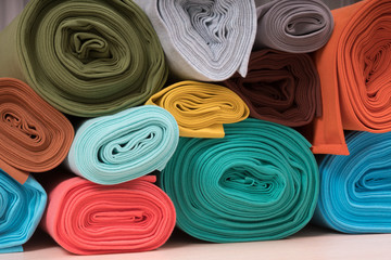 Rolls of knitted fabric in assortment