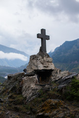 GEORGIA, KAZBEGI Orthodox cross near Caucasus mountains.