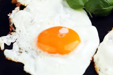 fried eggs with basil pepper and salt