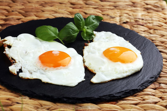 fried eggs with basil pepper and salt