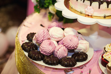 Candy Bar. Delicious sweet buffet with cupcakes. Sweet holiday buffet with cupcakes and other desserts.Table with sweets, candies, dessert,happy birthday concept